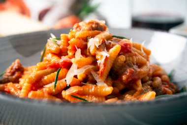 Malloreddus with pork sausage sauce, Italian food 