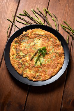 close-up view of omelette with asparagus 
