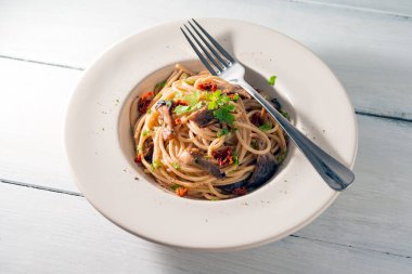 Close up of Delicious spaghetti with mushrooms and dried tomatoes