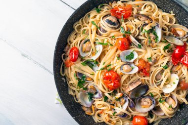 Top view of Delicious spaghetti with seafood and tomatoes