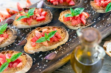 Authentic Italian bruschetta with fresh tomato, extra virgin olive oil, basil and oregano