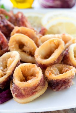 Dish of delicious fried calamari rings, italian food