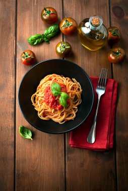 Dish of delicious spaghetti with tomato sauce, top view