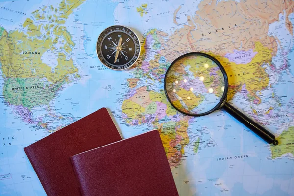 World Map Contains Magnifying Glass Compass Two Passports Concept Choosing — Stock fotografie