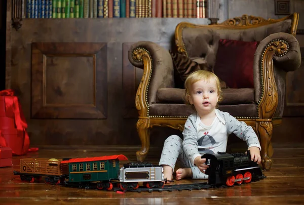 Small Infant Boy Sits Floor Plays Clockwork Train Games Activities — Zdjęcie stockowe