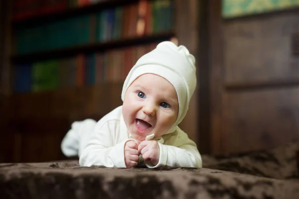 Little Newborn Baby Girl Lying White Clothes Background Bookcase — Zdjęcie stockowe