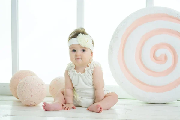 Little Girl Sitting Background Big Candy White Clothes Infant One — 图库照片