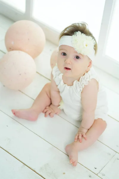 Little Girl Sitting Background Big Candy White Clothes Infant One — стоковое фото