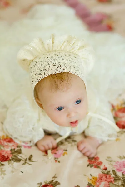 Baby Girl Blue Eyes Lying Blanket Child Wearing Dress Cap — Stock Photo, Image