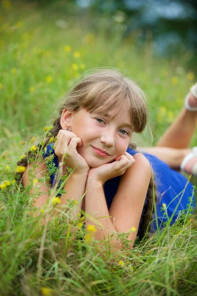 School Age Girl Blue Dress Two Long Braids Girl Lying — Stock Photo, Image