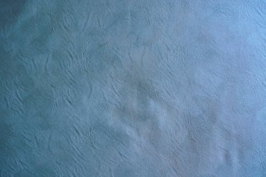 Kumaşın dokusu, tasarım için arka plan görüntüsü olarak gri hakiki deridir..