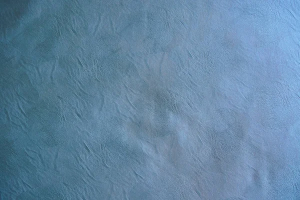 Kumaşın dokusu, tasarım için arka plan görüntüsü olarak gri hakiki deridir..