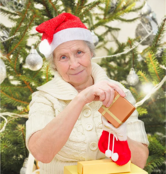 Grandmother with christmas gifts — Stock Photo, Image