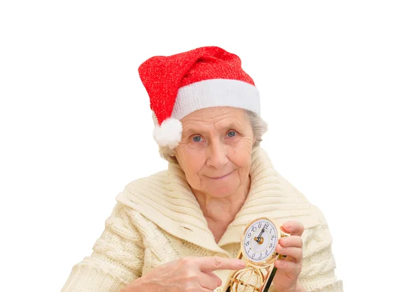 Avó em vermelho Papai Noel chapéu e relógio Imagem De Stock
