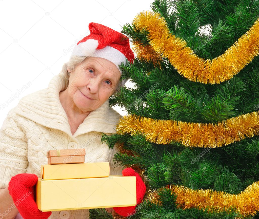 grandmother in Santa cap with Christmas gifts