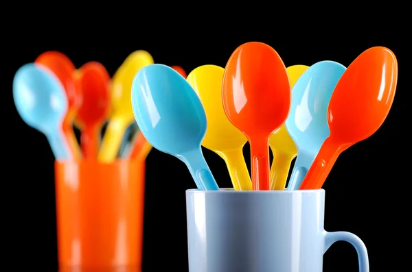 Colored plastic spoons — Stock Photo, Image