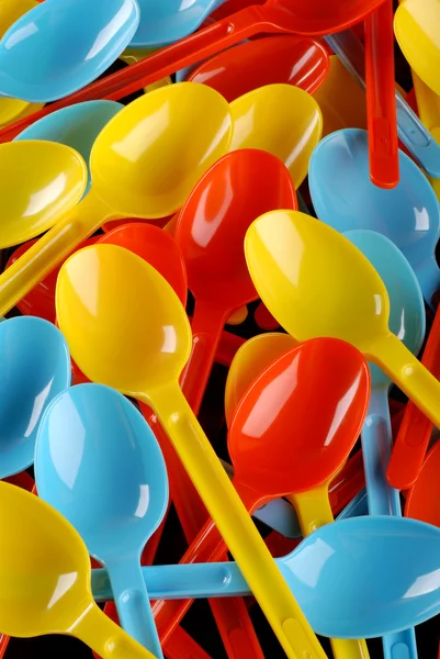 Colored plastic spoons — Stock Photo, Image