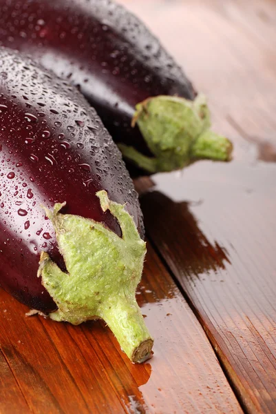 Eggplant on the wooden table — Stock Photo, Image