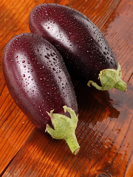 Eggplant on the wooden table — Stock Photo, Image