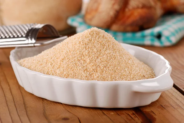 Breadcrumbs in white bowl — Stock Photo, Image