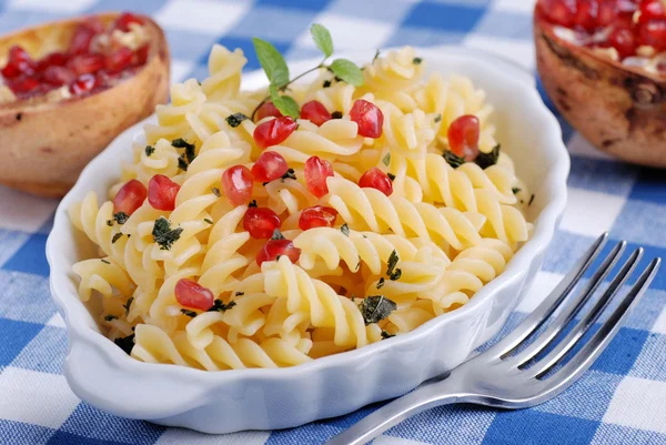 Fusilli with pomegranate seeds — Stock Photo, Image