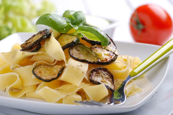 Pasta with fried zucchini — Stock Photo, Image