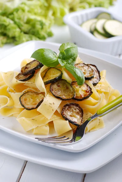 Pasta with fried zucchini — Stock Photo, Image