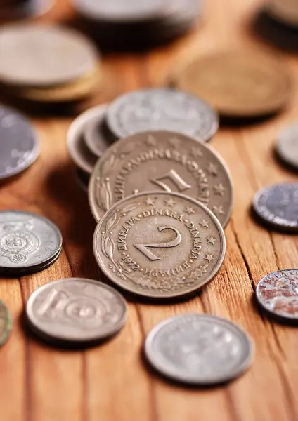 Coins on the wooden table — Stock Photo, Image