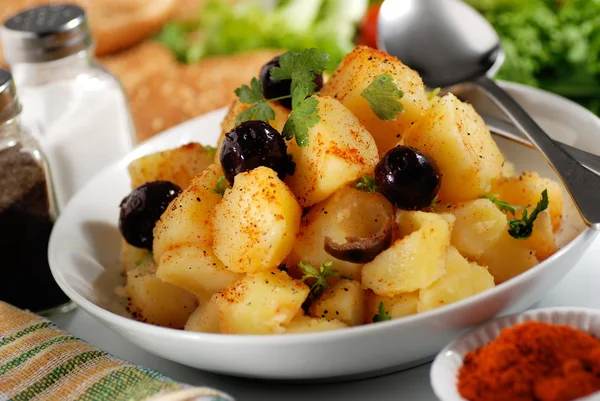 Potato salad in the plate — Stock Photo, Image