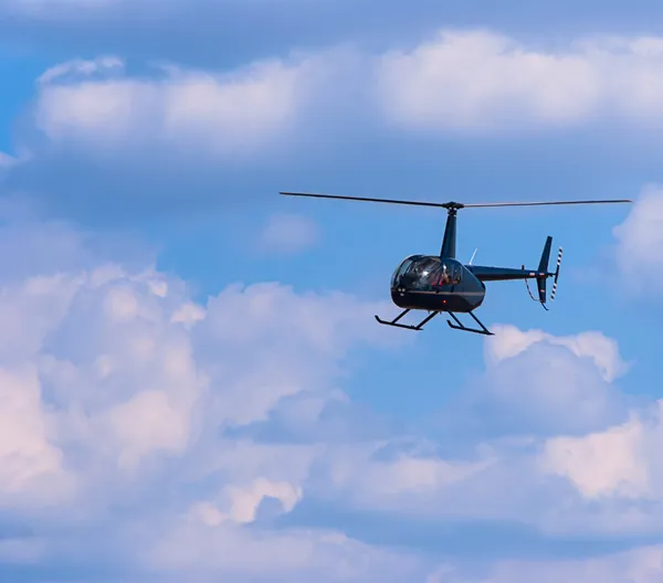 Civilian helicopter in the sky — Stock Photo, Image