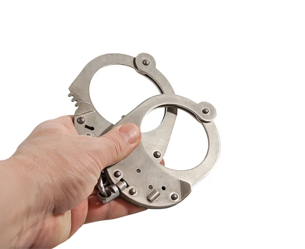 Мужская рука с наручниками изолированы на белом фоне — стоковое фото
