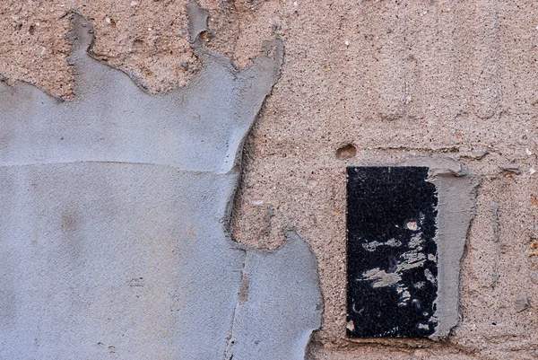 Plastered wall with a ceramic tile — Stock Photo, Image