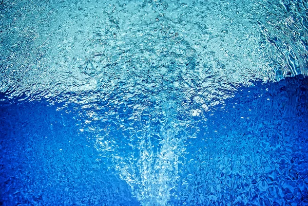 Closeup of bubbles in blue water — Stock Photo, Image