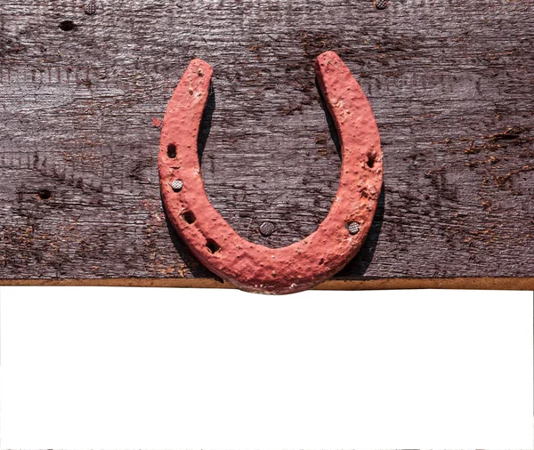 The old horseshoe hanging on wooden wall — Stock Photo, Image