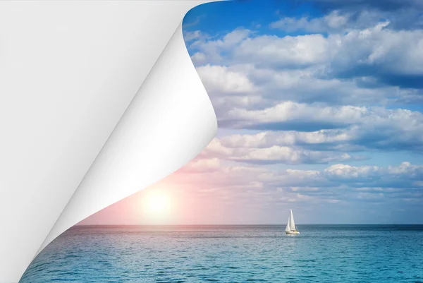 Curled page with a picture of the sea at sunset and a lonely boat — Stock Photo, Image