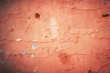 eski boyalı doku kırık. paslı kırmızı metal bir yüzeye