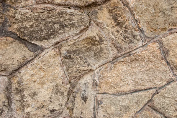 Partie d'un mur de pierre, pour le fond ou la texture. — Photo
