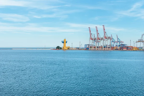 Port cargo crane and container over blue sky background — Stock Photo, Image