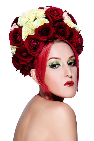 Portrait of beautiful girl with flowers roses in her hair — Stock Photo, Image