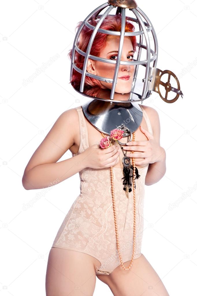 Girl with a bird cage on her head