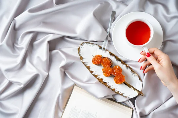 Breakfast Bed Concept Red Caviar Snacks Cup Tea Book Top — Stock Photo, Image