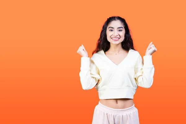Young Woman Rejoices Success Orange Background Copy Space — Stock Photo, Image