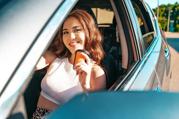 Beautiful Smiling Asian Ethnicity Woman Drinking Coffee While Sitting Car — Foto Stock