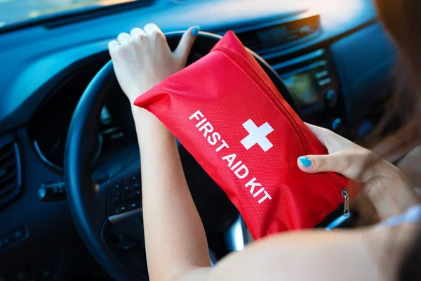 Car First Aid Kit Female Hands Steering Wheel Background Road — Fotografia de Stock