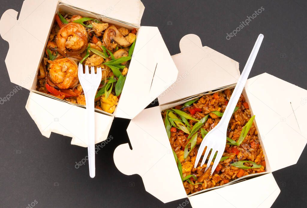 Wok boxes with glass noodles and rice. Top view.