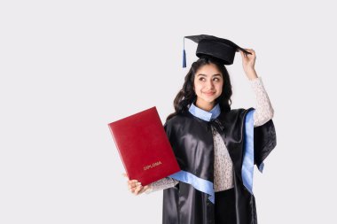 Beautiful indian woman university graduate wearing academic regalia with red diploma mockup isolated on white background.