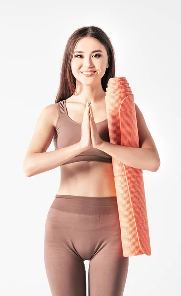 Asian Woman Holding Palms Together Fitness Mat White Background Vertical — Photo