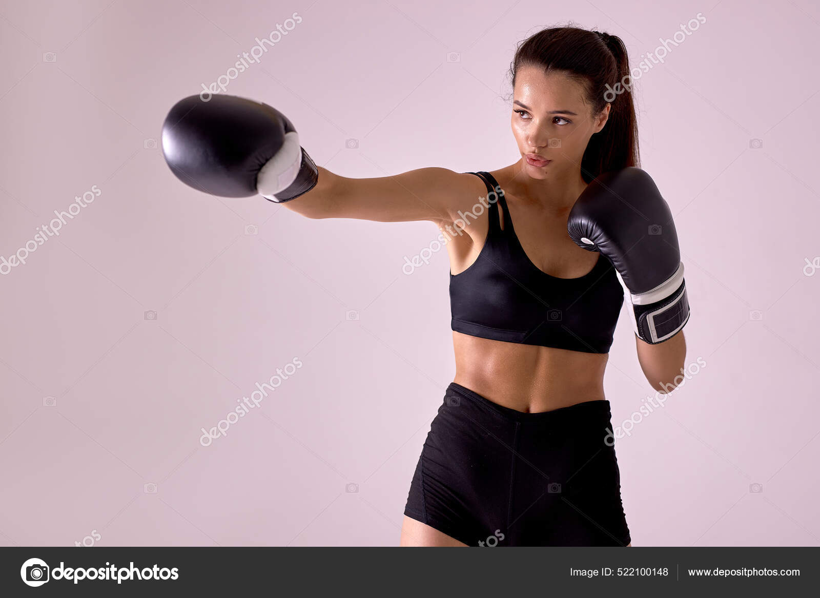 Confident beautiful woman athletic female MMA fighter training