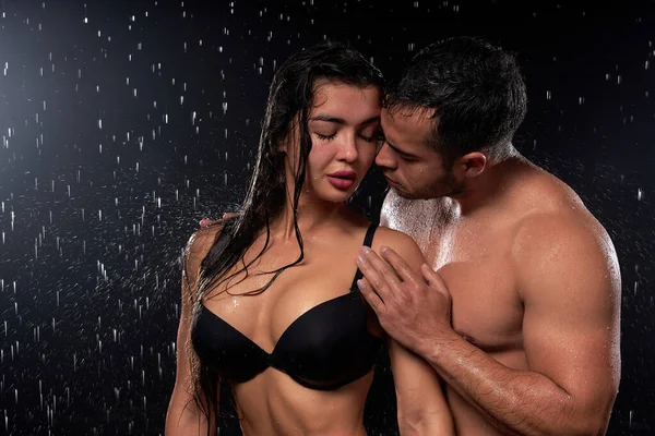 Close-up Portrait Of Wet Temptive Man And Woman With Naked Fitness Body Hugging