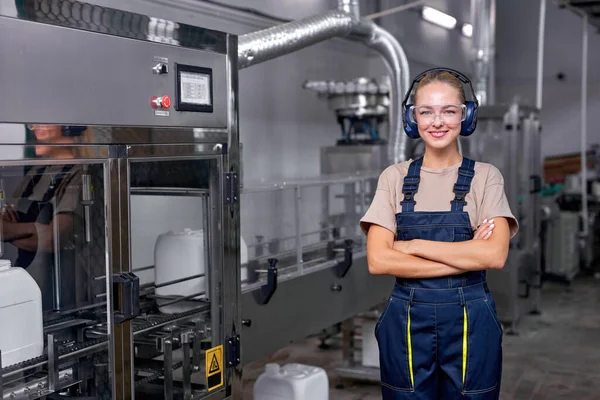 Female worker in protective workwear headset working in medical supplies research or factory — Stock Photo, Image